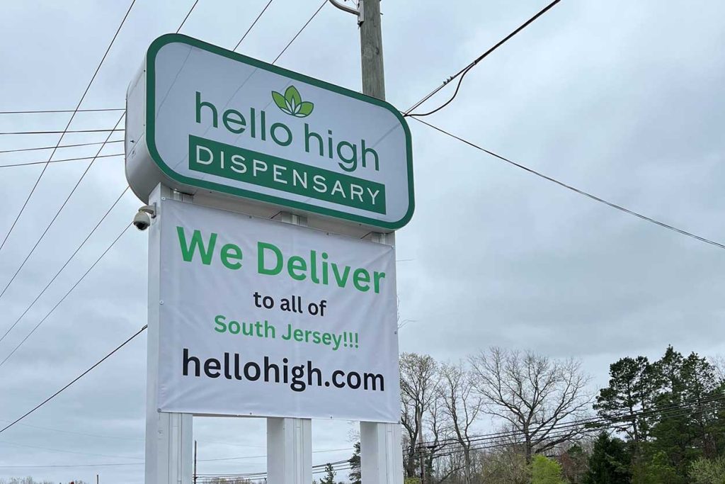 The sign outside of Hello High Dispensary in New Jersey. Offering free weed delivery to Atlantic City.